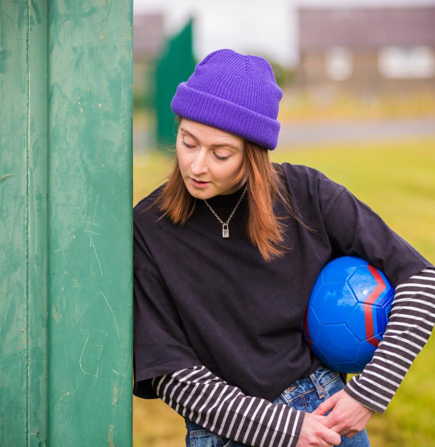 Bex holding a football 